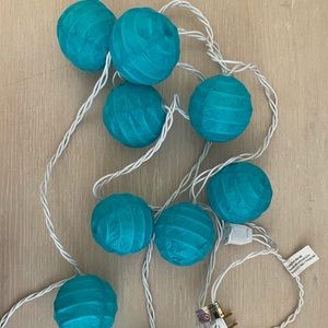 Teal paper orb string lights